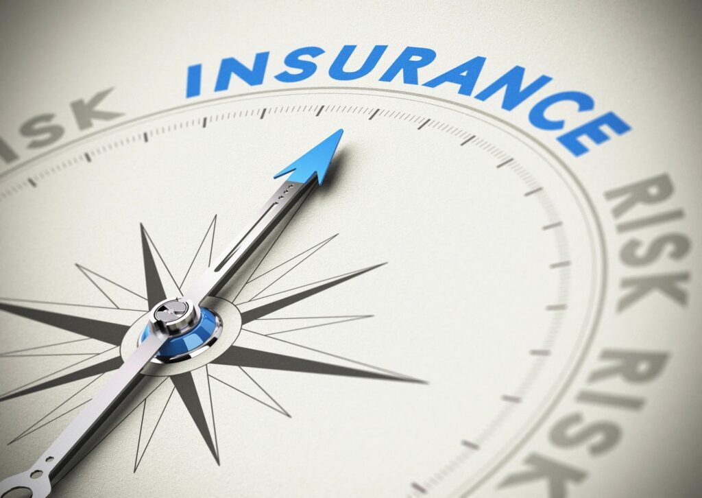 Compass needle pointing to the word 'INSURANCE' amidst 'RISK' labels.